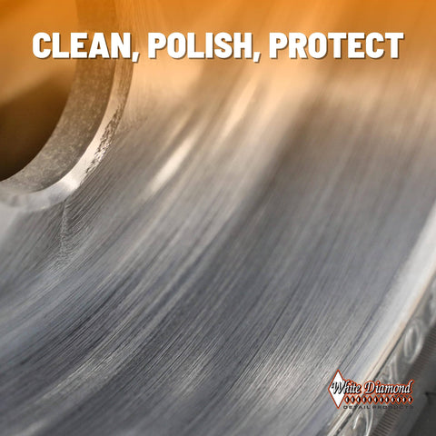 Close-up of metal surface with White Diamond logo, showcasing Metal Polish With Long Lasting Sealant Cleaner Polisher Protectant All In One