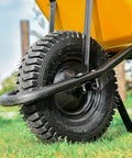 Close-up of a black tire with Tough As Nails Inner Tubes For 4.80/4.00-8 Inch Tires With TR87 Angled Valve on a wheelbarrow