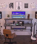 Music Studio Desk Production Workstation With Built In Power Outlet And USB Hub For Recording And Home Studio Use Studio Table For Beat Makers And Producers Grey Oak Finish Includes 3 USB Ports And 2 Outlets with instruments and screen setup.