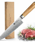 Eight Inch Damascus Steel Chef Knife With A Smooth Olive Wood Handle And Razor Sharp 10Cr15CoMoV Core, surrounded by fresh meat.