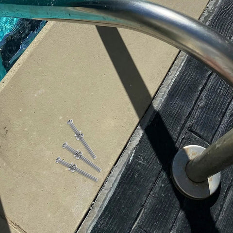 Three stainless steel fastener screws beside a pool ladder base, part of Six Piece Stainless Steel Pool Ladder Fastener Screws Hella Tough Premium Replacement Hardware Kit Rock Solid Marine Grade Step Bolts No Sweat Outdoor Install.