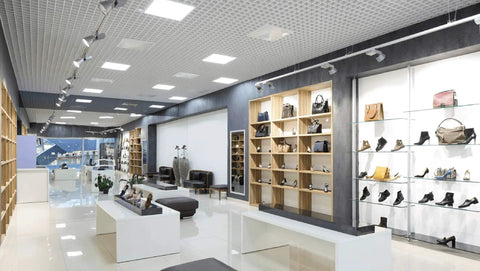 Modern retail store lit by Two Pack 2x2 Foot LED Flat Panel Light With Backlit 4550 Lumens 35W CCT 3000K To 5000K Dimmable panels