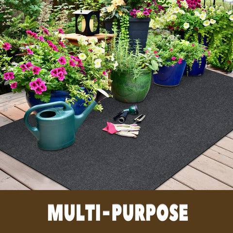 Oil Spill Mat For Garage Floor 3 By 7 Feet Under Motorcycle Waterproof Durable Non Slip TPR Backing Reusable Absorbent Pad Charcoal Heavy Duty Oil And Water Drip Catcher For Workshop And Garage placed on wooden deck with gardening tools and plants.