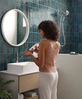 Woman in bathroom near Aromatherapy Shower Combo With Dual Showerheads Handheld And Rain Shower INLY Capsule Technology
