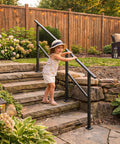 Child using Heavy Duty Outdoor Hand Rail For 2 To 3 Steps Black Iron Style Stair Railing For Concrete Brick Wood Stairs