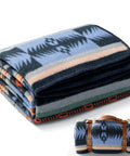 Folded 100 Percent Virgin Wool Blanket 62 By 86 Inches Warm Thick And Washable with leather strap, tribal pattern design