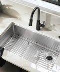 Matte Black Garbage Disposal Air Switch Decorative Button Only Housing Required Coordinating With Air Switch Sold Separately Slick Modern Kitchen Island Install, shown with silver sink and black faucet.