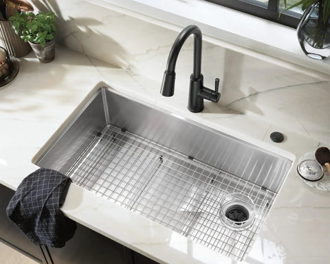 Matte Black Garbage Disposal Air Switch Decorative Button Only Housing Required Coordinating With Air Switch Sold Separately Slick Modern Kitchen Island Install, shown with silver sink and black faucet.