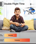 Child playing with Beginner Friendly Remote Control Helicopter With Altitude Hold And Dual Speed Modes For Adults And Kids Big Size S39H Drone One Key Takeoff And Landing Includes Two Batteries Blue indoors.