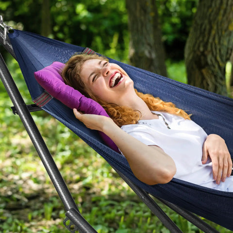 Person relaxing in a Two Person Hammock With Stand Foldable Outdoor Hammock Set 600 Lb Capacity Portable Carrying Case Aegean Color