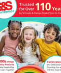 Three smiling children sitting together in a colorful environment representing S&S Worldwide's commitment to quality and family values.