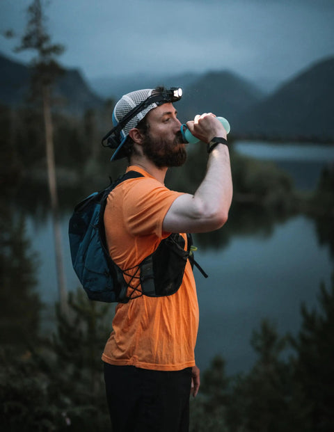 Person wearing Hardworking Tactical LED Headlamp With Five LEDs 650 Lumen Spot And Flood Beam Plus Hardhat Mount outdoors