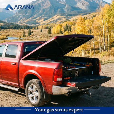 Red pickup truck with open fiberglass tonneau cover supported by 27 Inch 45lb Gas Strut For Fiberglass Tonneau Cover And Pickup Truck Bed