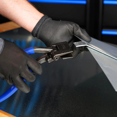 Midwest Seamer Tong, 3-inch offset sheet metal bender, shown in use with gloved hands and blue air hose.
