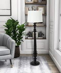 Benjamin Traditional Floor Lamp Satin Black Finish with Resin Construction in a living room setting, showcasing classic charm and elegance.