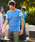 Series 9 Portable Wired and Wireless Doorbell With 11 Preinstalled Tunes 450 Foot Range Easy Install Wall Mount Or Tabletop Setup Adjustable Volume Up To 90 Decibels on a picnic table during a backyard barbecue.