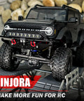 Black TRX4M Bronco with Front And Rear Aluminum Tube Bumper Set For 1/18 TRX4M Bronco Crawler Lightweight Metal Armor With LED Front Bumper For Night Drives Removable Tow Hitch On Rear No Mods Required Fits Stock Body on rocky terrain