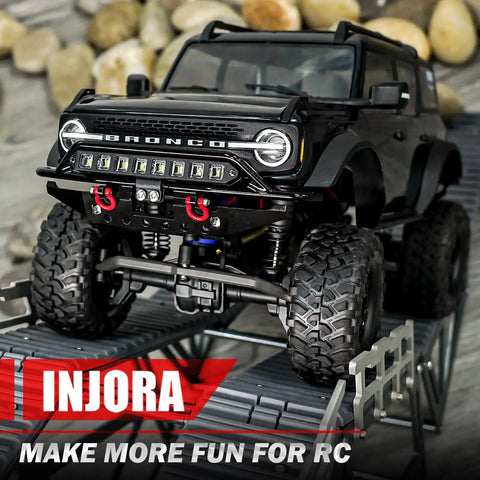Black TRX4M Bronco with Front And Rear Aluminum Tube Bumper Set For 1/18 TRX4M Bronco Crawler Lightweight Metal Armor With LED Front Bumper For Night Drives Removable Tow Hitch On Rear No Mods Required Fits Stock Body on rocky terrain