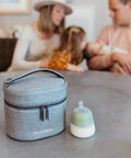 Keep It Chill On The Fly Breastmilk Bottle Cooler Travel Bag With Included Freezing Insert Compact Triple Layered Thermal Carrier on a table.