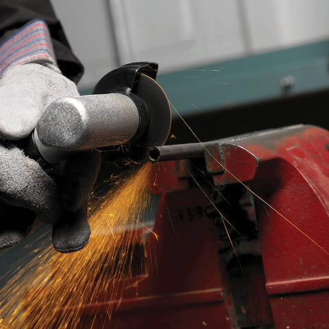 Worker using Beefy Three Inch Cut Off Wheel Type One Sixteenth Inch Thick With Three Eighths Inch Arbor A36T 56091 Ten Pack For Aggressive Cutting And Grinding Open Arbor For Fast Clean Slices on metal pipe
