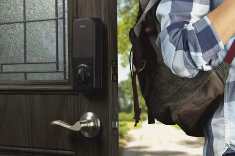 Touchscreen Smart Door Lock With Keypad And Bluetooth Motorized Deadbolt One Tap Entry Easy Setup Remote App Control See Who Entered And When 20 Unique Access Codes Black DB1 installed on door with person nearby