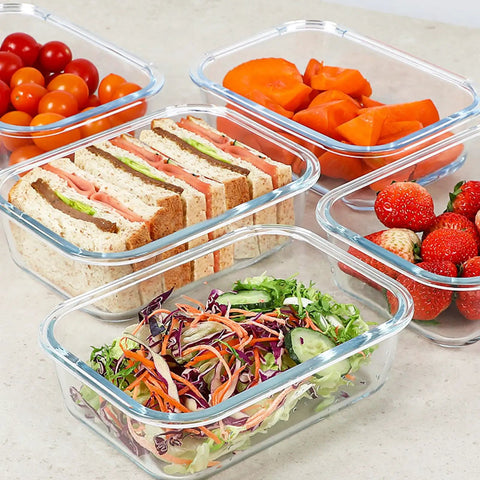 Five 30 Oz Glass Meal Prep Containers Set Of Five With Lids Durable Glass Storage For Lunches And Leftovers Dishwasher Safe Microwave Safe Oven Safe Freezer Safe Portion Control Containers For Everyday Meal Prep filled with fresh food on counter.