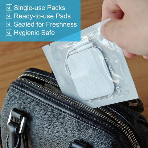 Heavy Duty Tens Therapy Pads With Pad Holder 24 Pack Boasting Thick Conductive Gel being taken from a black bag, showing sealed single-use pack.