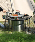 Camping scene with Portable Fire Pit Surround Tabletop for Solo Stove Bonfire Ranger, folding iron design, outdoor use.