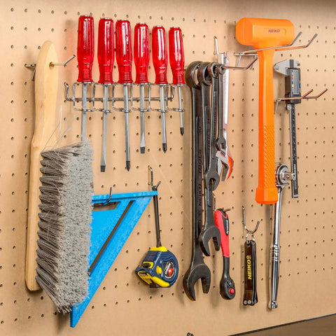 Pegboard Hook Set 50 Piece Heavy Duty Assortment For One Quarter Inch Pegboards Includes Hooks And Holders For Garage Workshop And Craft Room Organization Wall Mount Storage For Tools And Supplies showing tools neatly organized.