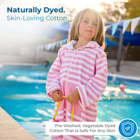 Child wearing pink Ultra Soft Turkish Cotton Kids Bathrobe And Hooded Towel Poncho With Zip Up, Terry Lining And Pockets by pool.