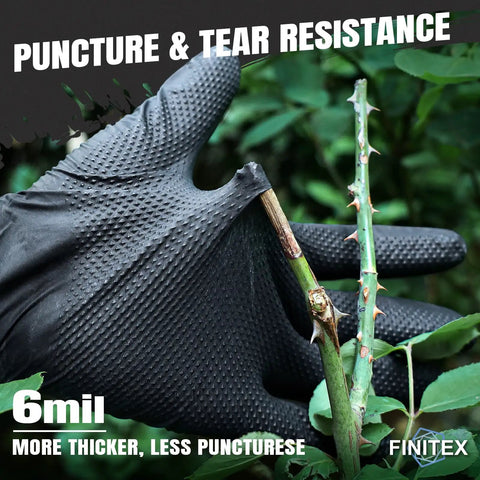 Heavy Duty Black Nitrile Disposable Gloves Bring Tough As Nails Defense With A Rock Solid Grip Pattern And 6.3 Mil Thick Shield To Dodge Razor Blades Or Slippery Grease Sold In Pack Of One Hundred Medium Sized Tools For Badass Industrial Use, shown gripping a thorny branch.
