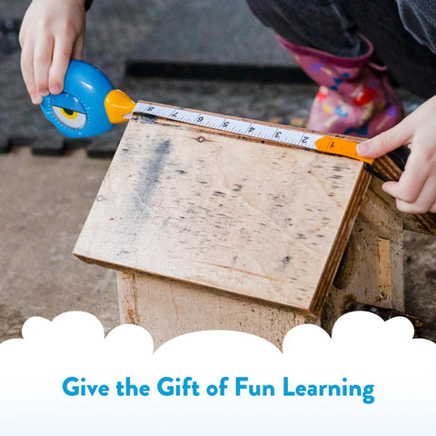 Kid Friendly 8 Foot Tape Measure with Blue Bird Design STEM Educational Tool on wooden birdhouse with child using it