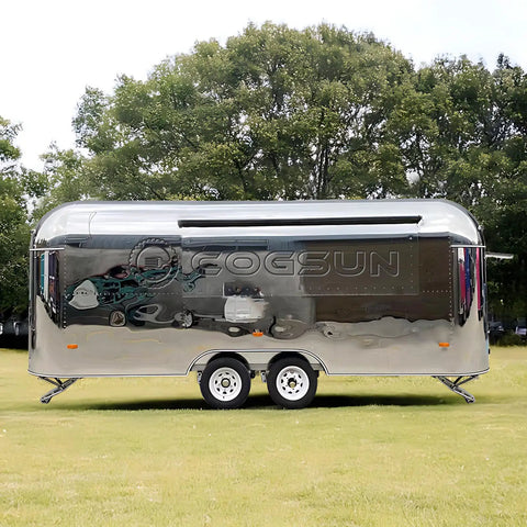 Lightweight Mobile Food Trailer With Full Plumbing And Electrical Wiring Solid Rig For Your Downtown Block Party Or Street Food Hustle Ready To Roll Smooth Today, silver exterior in a grassy area.