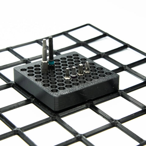 Modular 1/4-Inch Hex Bit Organizer System with 77 Slots for Fast Access Driver Bit Holder, black finish, shown in grid layout