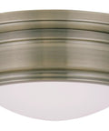Astor 2 Light Ceiling Mount in Antique Brass with hand-blown satin glass, transitional steel fixture, classic vibe and clean lines.