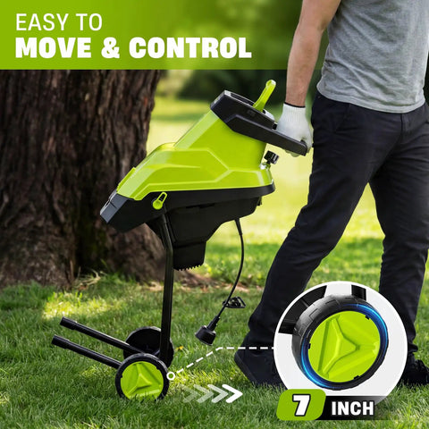 Person moving Powerful 15 Amp Wood Chipper And Shredder for easy yard cleanup with 1.8 inch cutting diameter