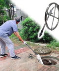 Professional Grade Heavy Duty Manganese Steel Sewer Snake And Drain Rooter Flat Design Pipe Auger being used on a sewer.