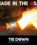 Welding sparks flying as metal is cut, with 'Made in the USA' text and Tie Down manufacturing logo visible in image.