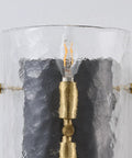 Close-up of MWZ Modern 2-Light Wall Sconce Set of 2 with Water Rippled Glass Shades 11" showing curved glass and light bulb.