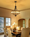 Modern Black Crystal Chandelier With 5 Lights, Farmhouse Style Dining Room Fixture above a dining table with flowers and candles.