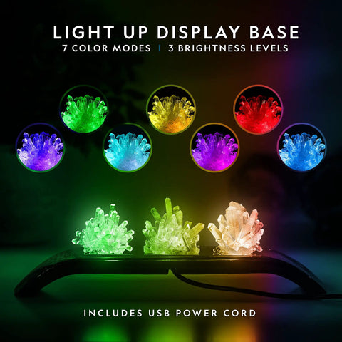 Awesome Crystal Growing Kit For Kids with Light Up Display Stand featuring vibrant green and white crystals on black base.