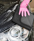 Person using Super Absorbent Microfiber Car Drying Towel Thickened Lint Free Auto Wash Cloth on a soapy car hood.