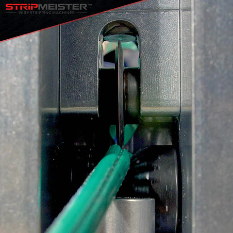 Replacement Blade Kit For Original And E250 Wire Strippers cutting green wire smoothly, fitted in machine.
