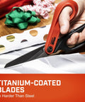 Close-up of Heavy Duty 10 Inch Titanium Coated Tradesman Shears with serrated blades cutting wrapping paper.