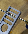 Close-up of All In One Knife Sharpening Kit That Seriously Handles 6 Stones For Straight And Serrated Blades angle guide in use.