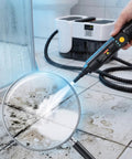 Get Ready For A Sparkling Clean With This Volcm Steam Cleaner in action, removing grime from tile with steam nozzle.