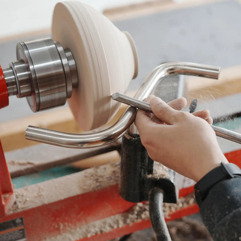 Close-up of hands using Stainless Steel S Shaped Tool Rest Set for woodturning lathe bowls with 9 inch crossbars