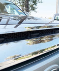 Close-up of smoked lens amber LED grille lights installed on 2014-2021 Toyota Tundra with chrome grille detail.