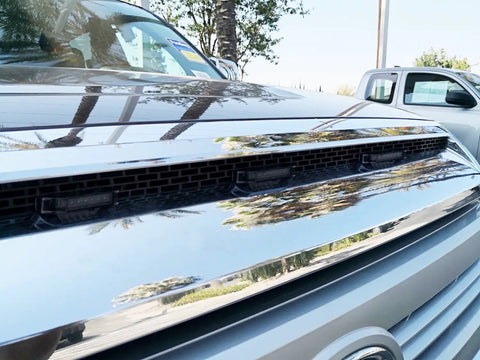 Close-up of smoked lens amber LED grille lights installed on 2014-2021 Toyota Tundra with chrome grille detail.