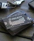 Mini 3 Inch Metal Science Ruler And Multitool With Metric And Imperial Scales Protractor And Compass on leather wallet